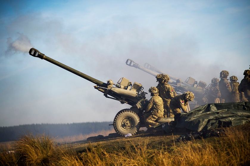 Soldiers of the Royal Artillery firing 105mm Light Guns during an exercise. Photograph: Ministry of defence
          